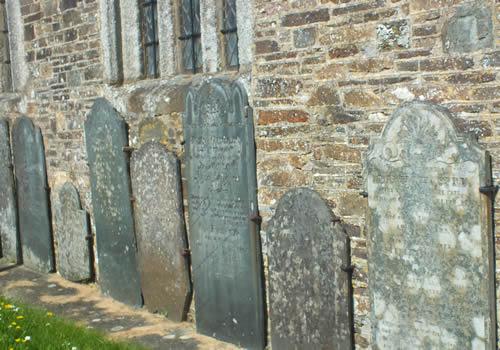 Photo Gallery Image - Ancient gravestones by the church